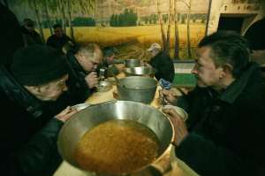 Popova - men eat soup
